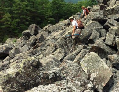 Doug Blodgett and Kerry Monahan do the "rock dance" down a talus slope. Photo S. Faccio